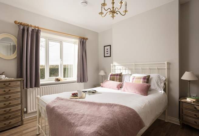 The ground floor bedroom looks so inviting.