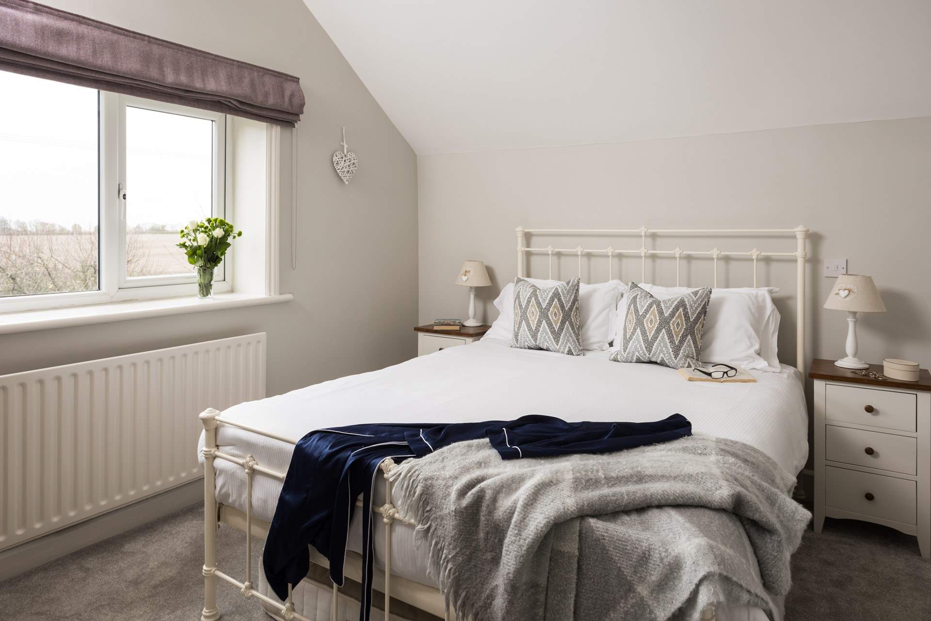 Another beautiful bedroom with views over the fields.