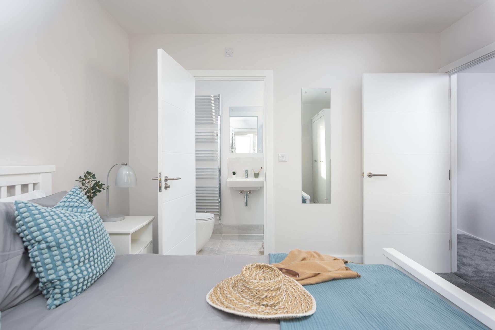 Beautiful linens await you in the principle bedroom.