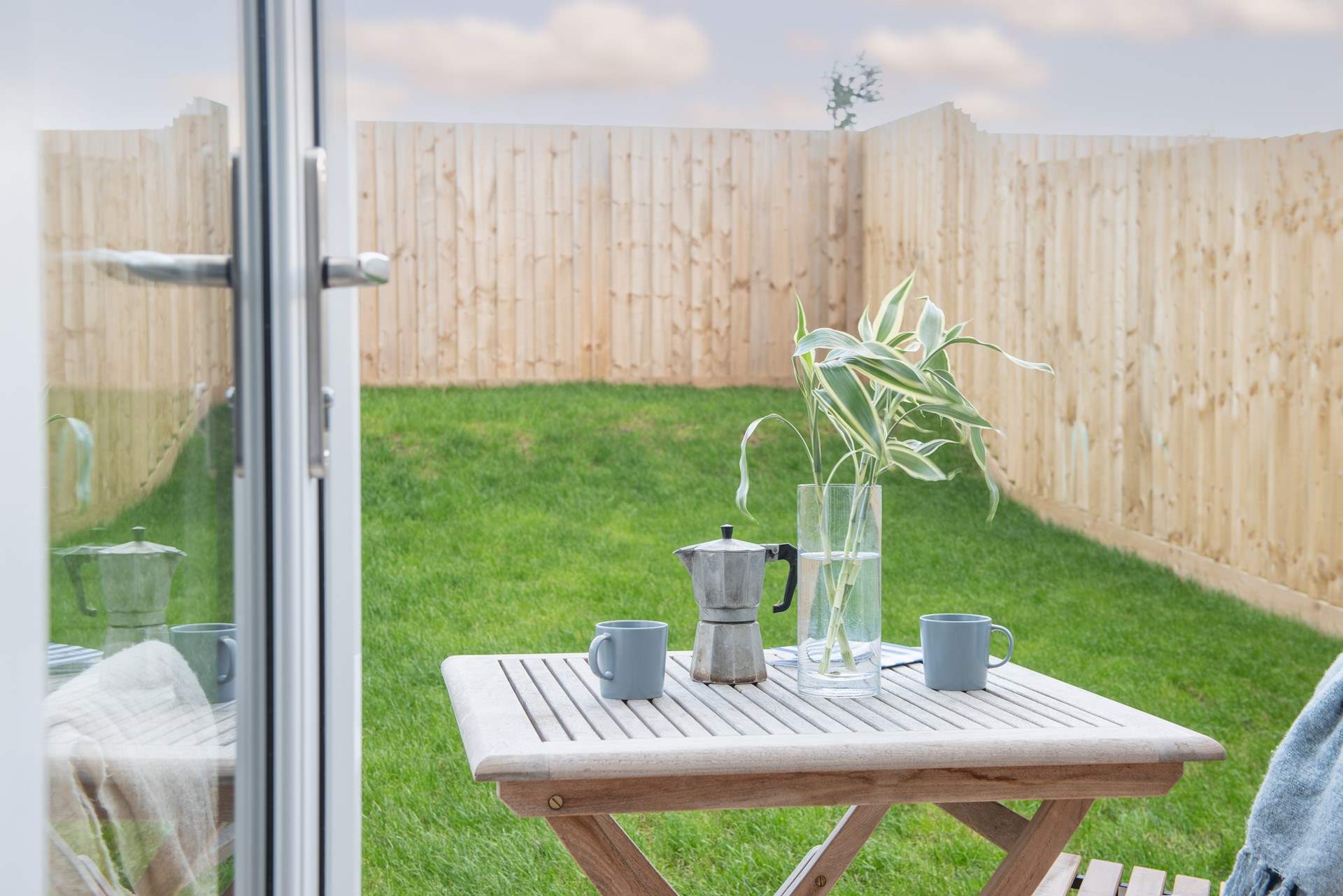 Double doors open to the patio and lawned garden -  enjoy your morning coffee in the sunshine. 
