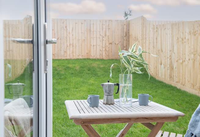 Double doors open to the patio and lawned garden -  enjoy your morning coffee in the sunshine. 