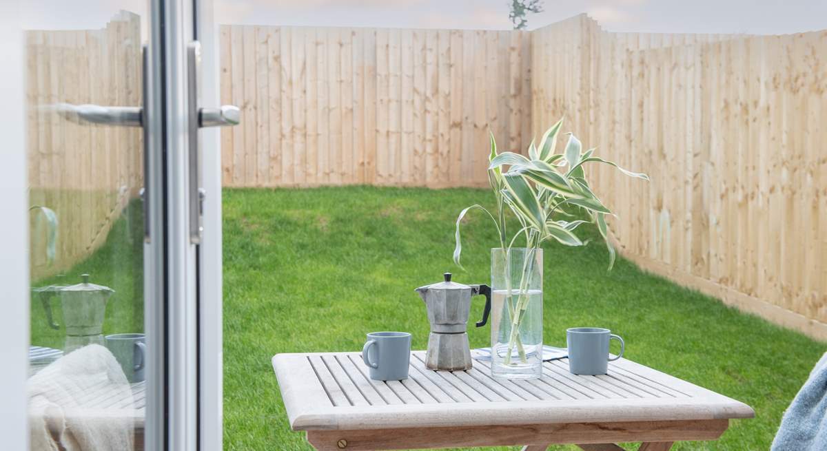 Double doors open to the patio and lawned garden -  enjoy your morning coffee in the sunshine. 