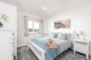 The main bedroom has a super-comfy king-size bed.