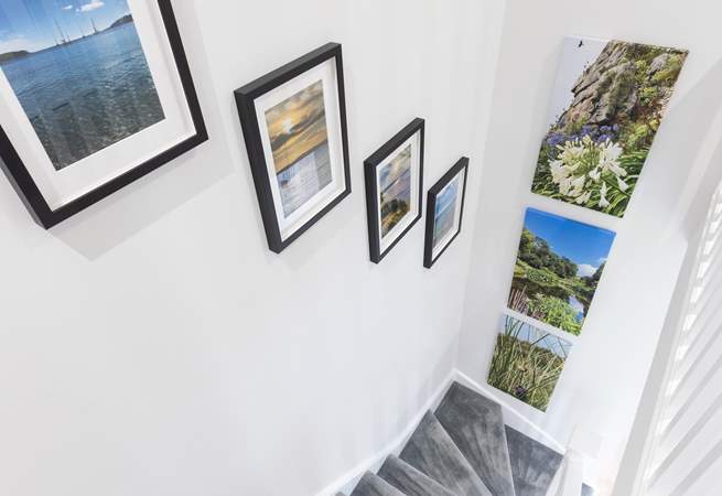 Beautiful pictures taken by the owners line the stairs. 