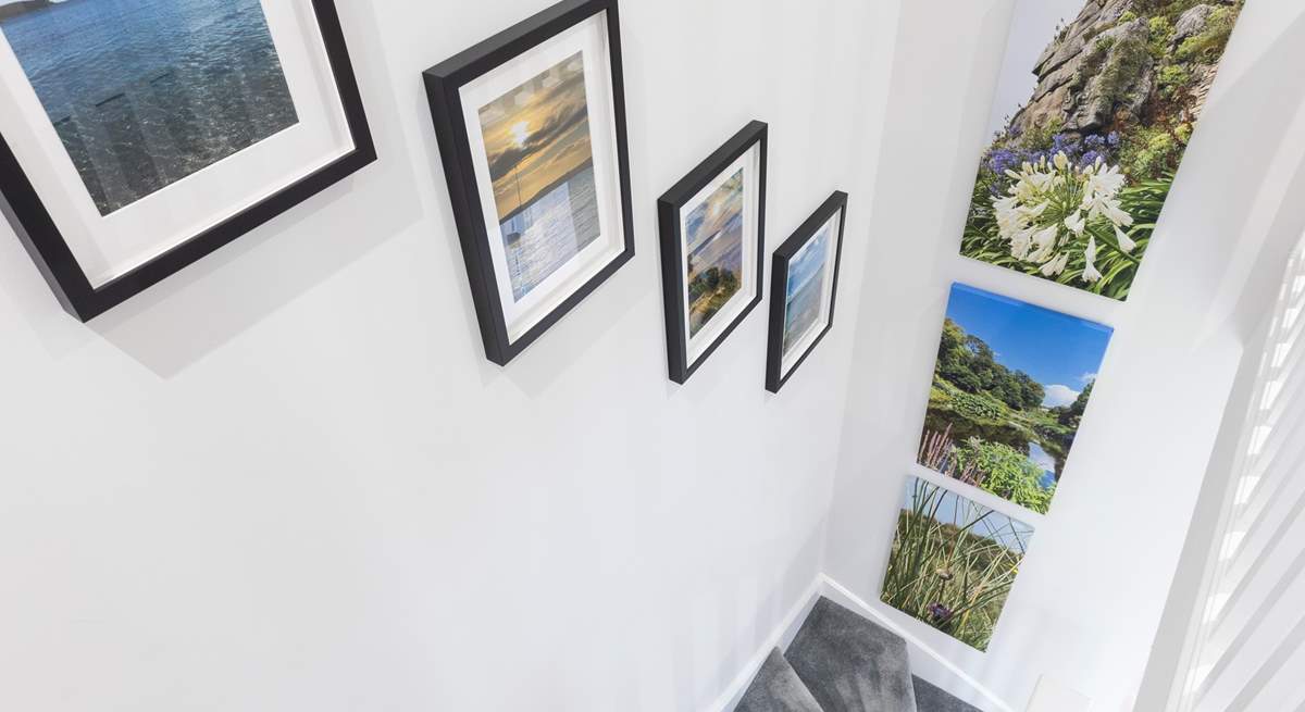 Beautiful pictures taken by the owners line the stairs. 