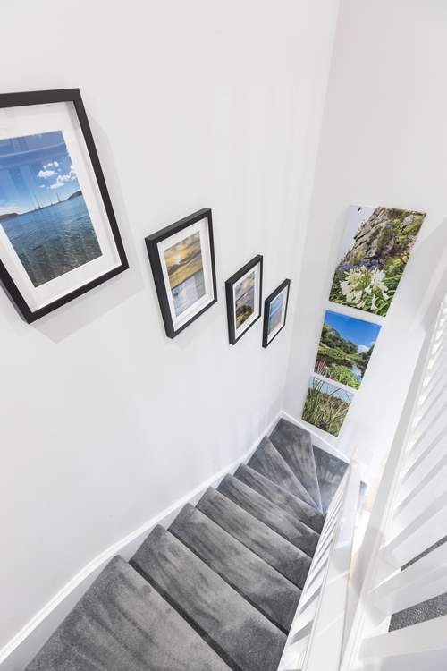 Beautiful pictures taken by the owners line the stairs.