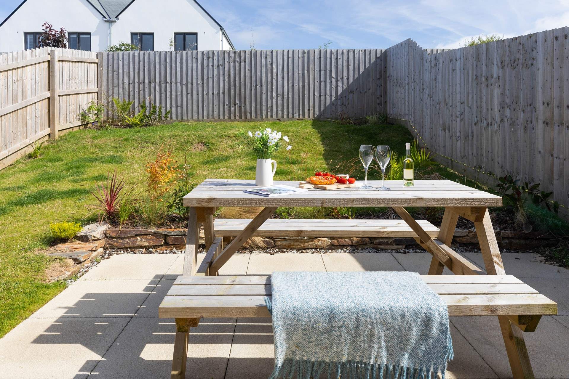 Patio doors open from the kitchen to the largen and terrace. 