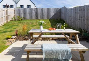 Patio doors open from the kitchen to the largen and terrace. 