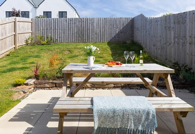 Patio doors open from the kitchen to the largen and terrace. 