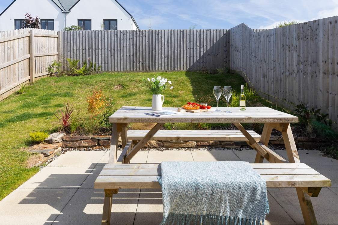 Patio doors open from the kitchen to the largen and terrace.