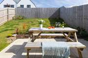 Patio doors open from the kitchen to the largen and terrace.