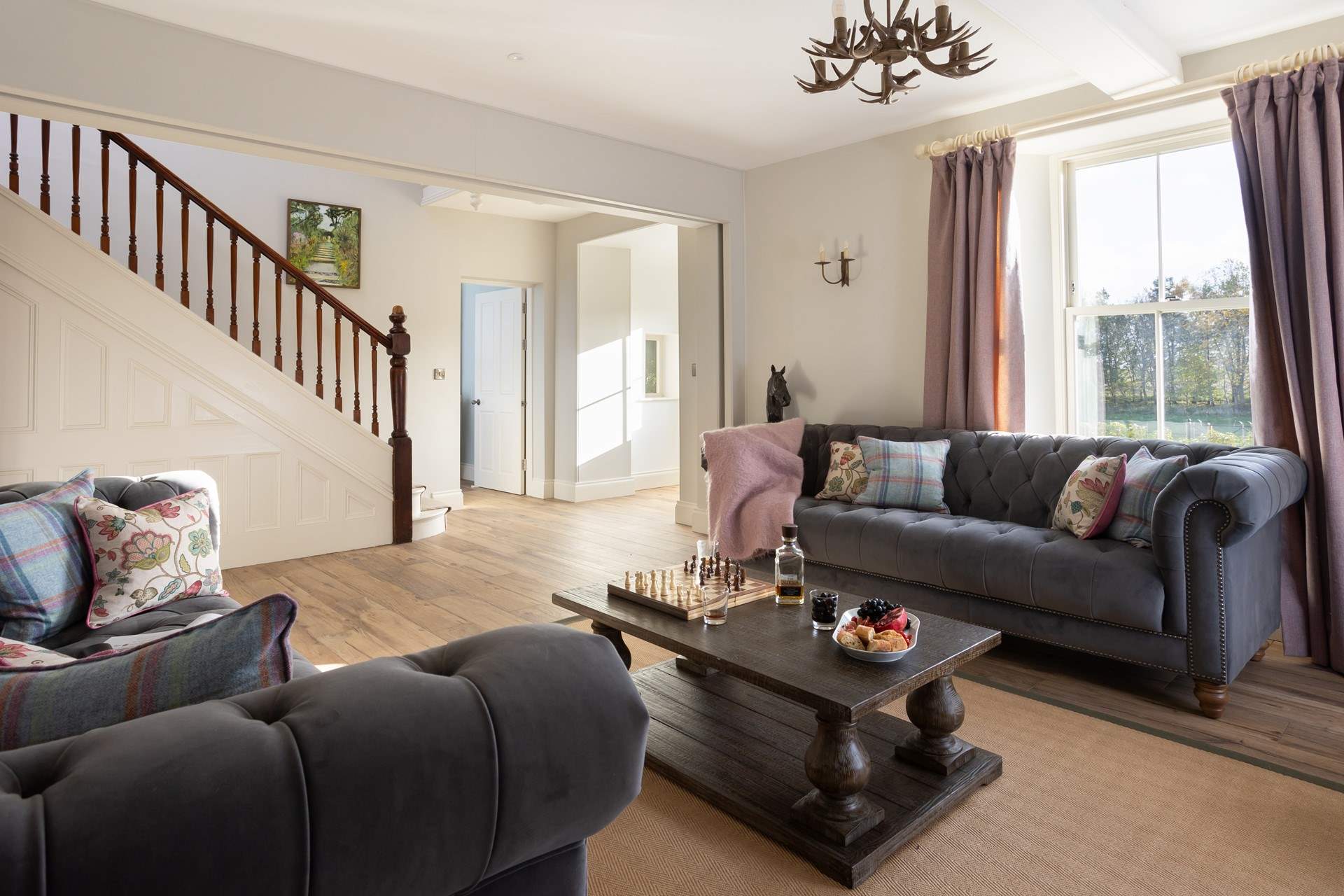 The sitting-room leads onto the front garden, look at the sun streaming in. 