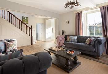 The sitting-room leads onto the front garden, look at the sun streaming in. 