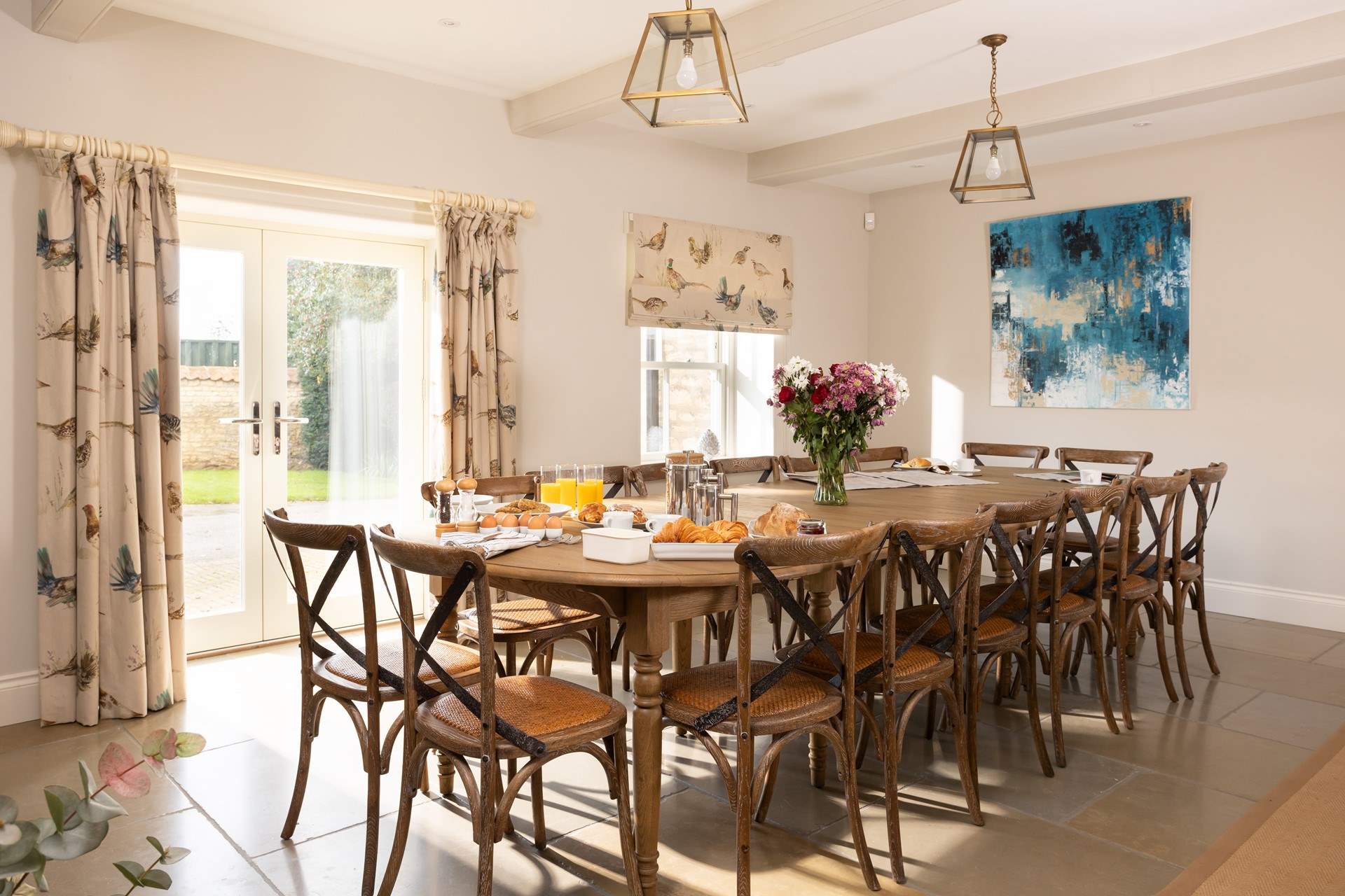 The dining-room leads out onto a sunny terrace.
