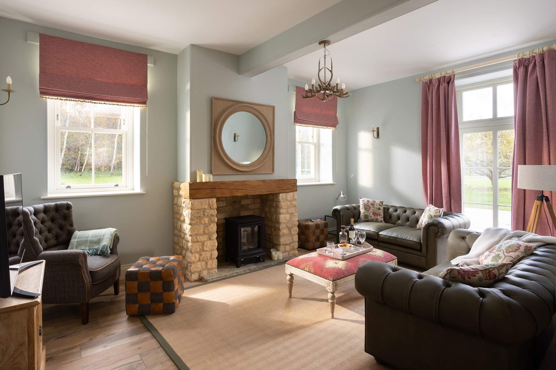 The snug is such a cosy room which opens onto a large patio and the gardens. 