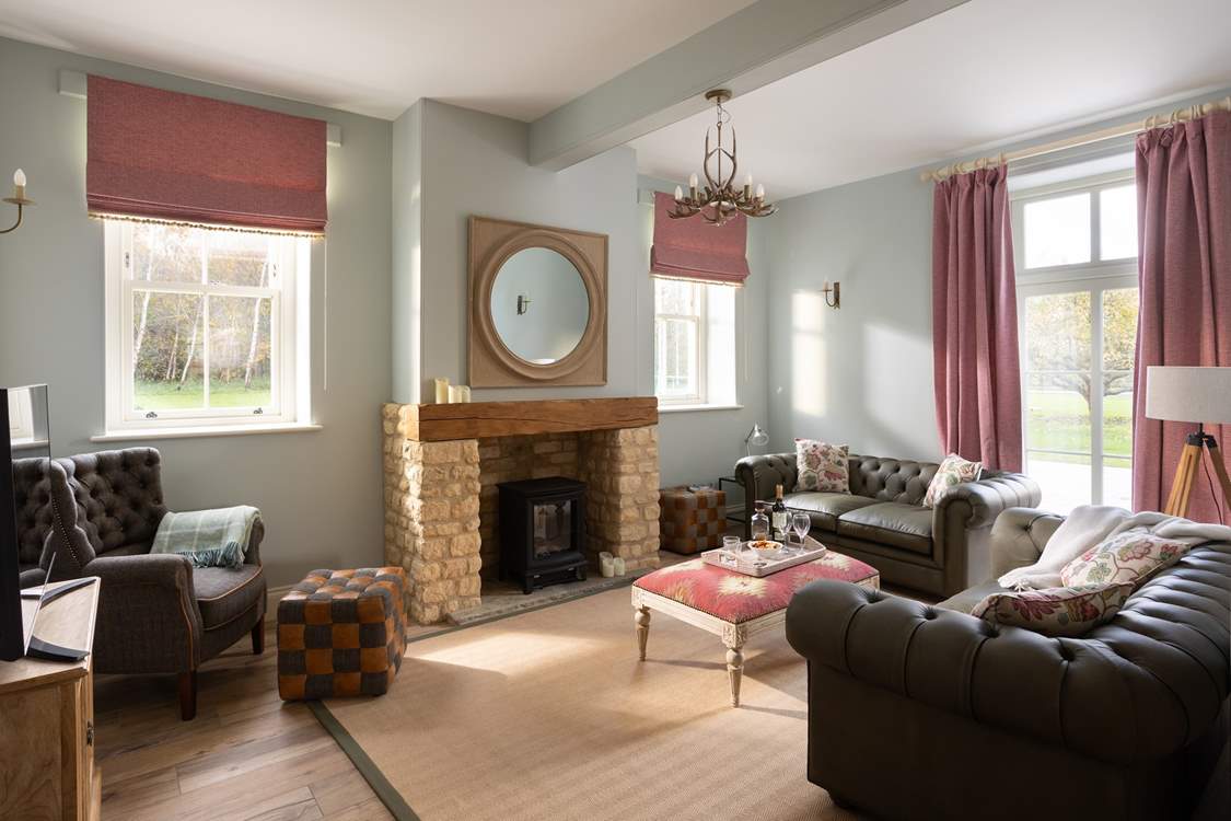 The snug is such a cosy room which opens onto a large patio and the gardens.