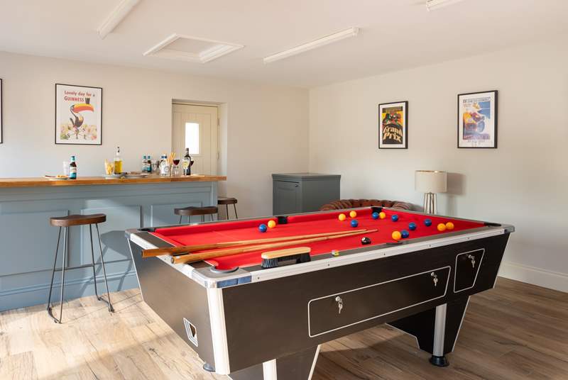 The large games-room has a bar, pool table and TV. Get together and have some fun.