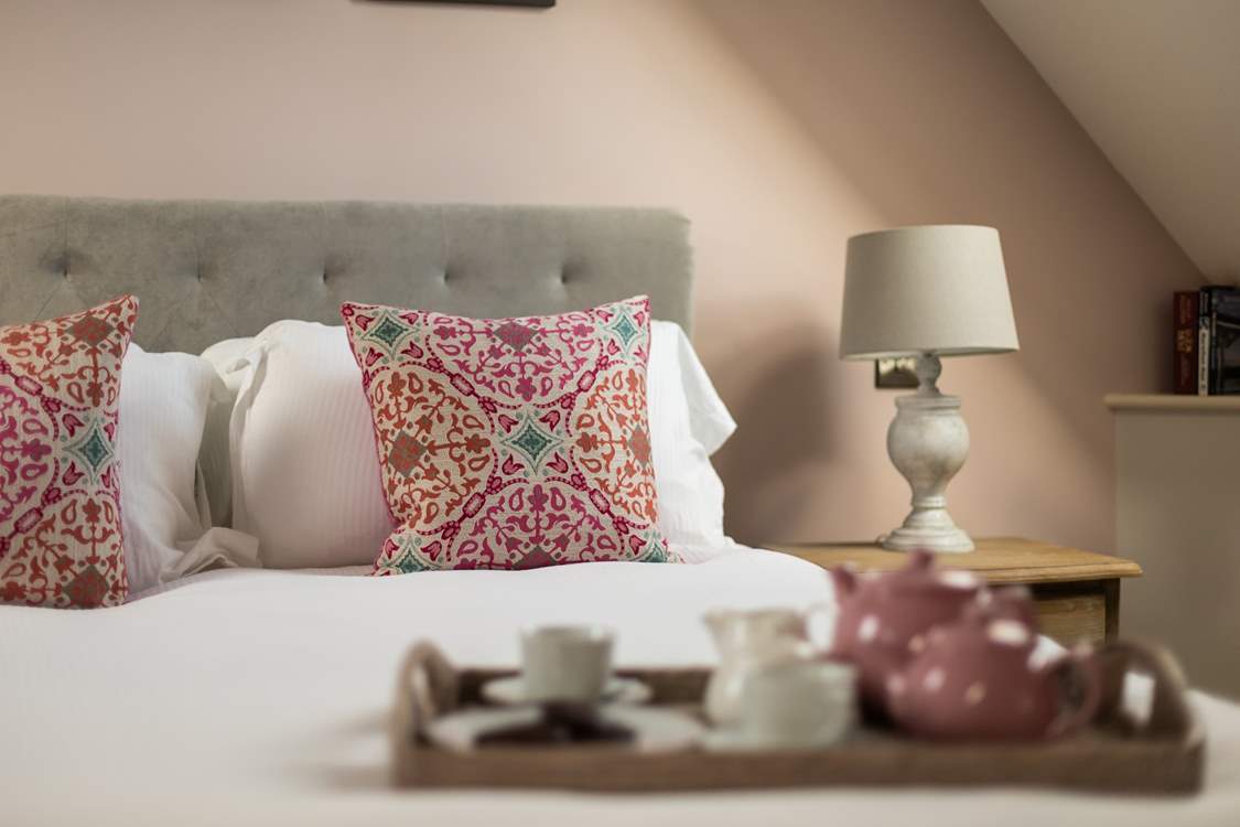 The king-size bed is just the place to indulge in a morning lie in.