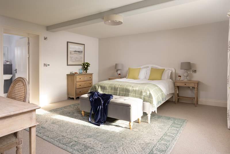 There's plenty of space in this luxurious bedroom, lie back and luxuriate in the king-size bed.