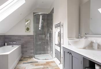 En suite bathroom, enjoy a long soak after a busy day.