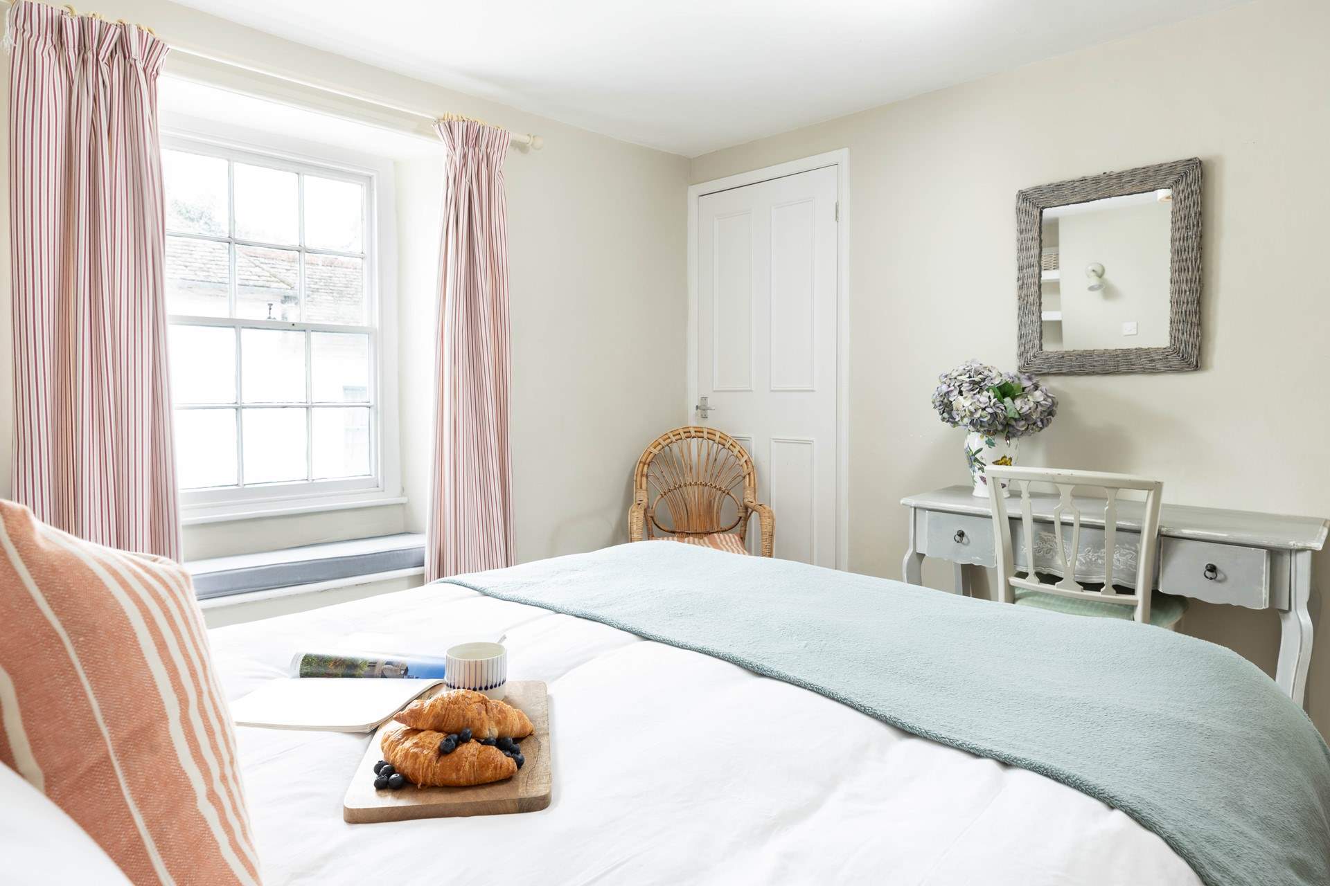 Bedroom 1 is spacious and has a window seat. 