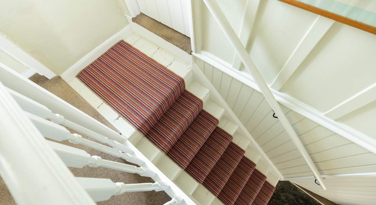 The split-level landing at the top of the stairs is typical for this age of property.