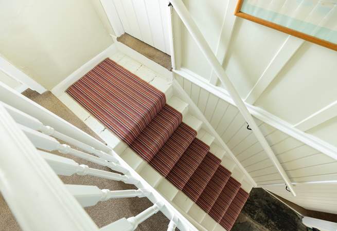 The split-level landing at the top of the stairs is typical for this age of property.