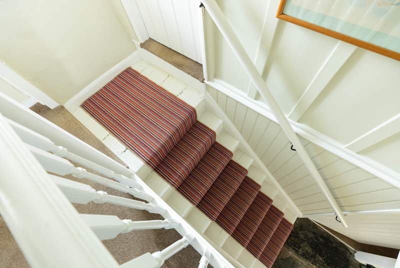 The split-level landing at the top of the stairs is typical for this age of property.