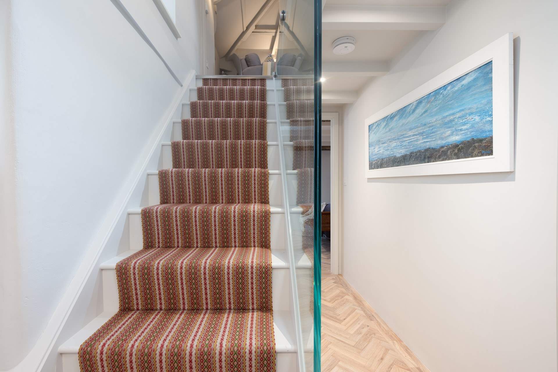 The stairs up to the first floor living-room.