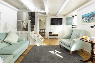 The sitting-room leads through to the kitchen/diner.