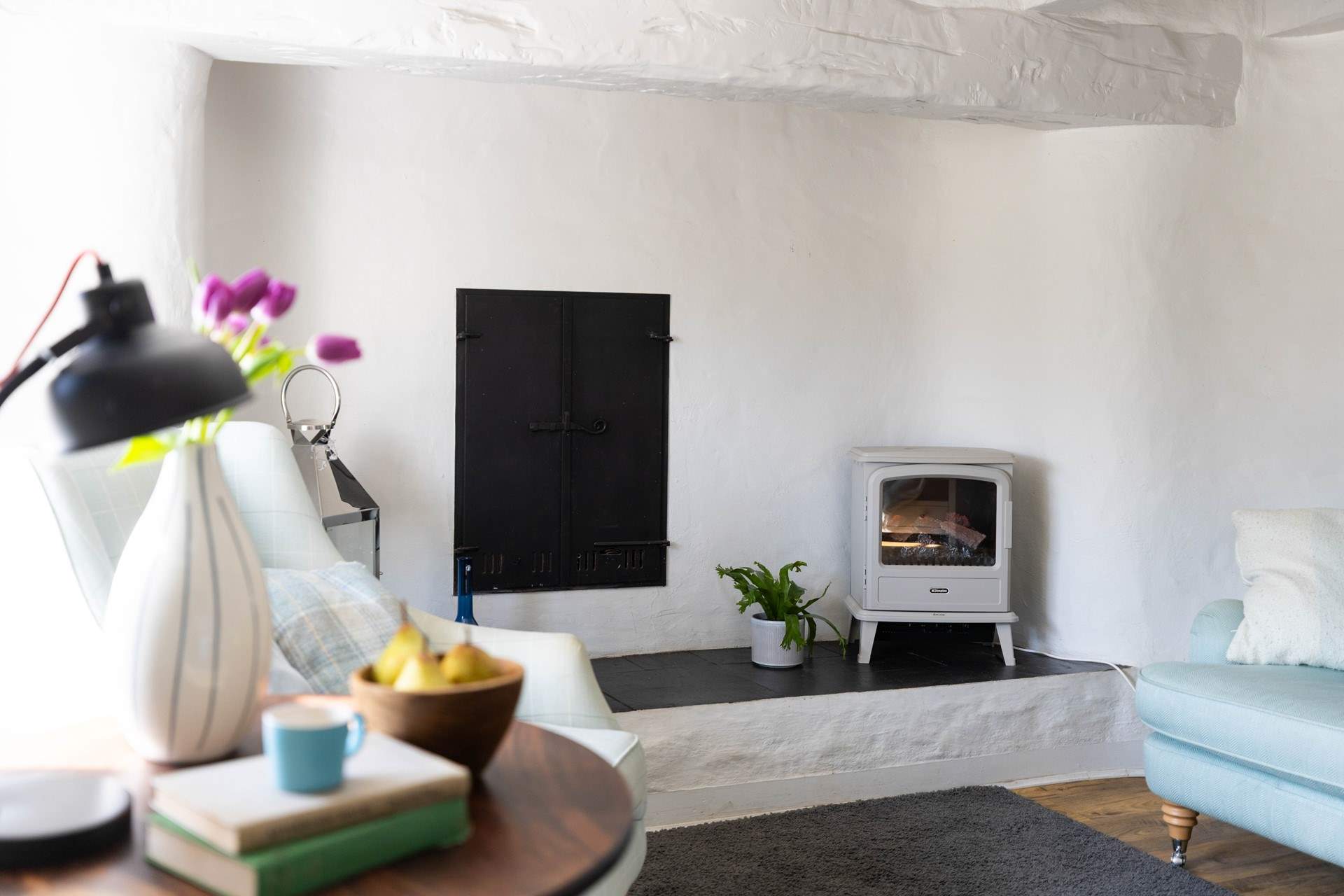 Snuggle up in front of the electric wood burning stove. 