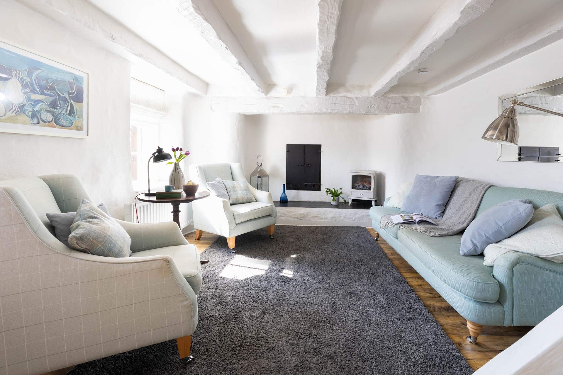 The pretty sitting room is the perfect spot to relax. 