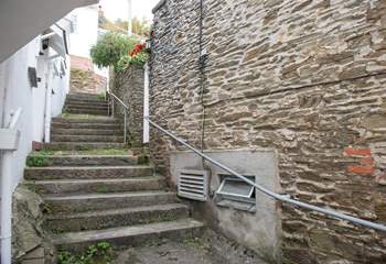 Follow the steps at the side of the property to access Careema. 