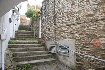 Follow the steps at the side of the property to access Careema.
