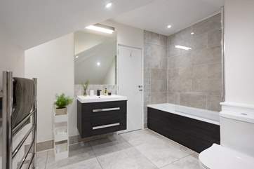 The en suite bathroom to bedroom three.