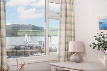 Watch the boats pass by in the harbour.
