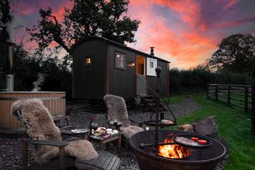 Magical moments await - soak in the steamy hot tub or stay snug beside the flickering fire-pit.