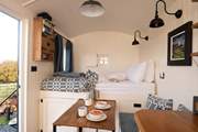 Open up the door and let fresh air flow through the hut.