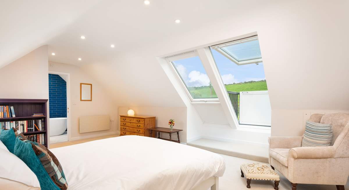 On the first floor, the spacious luxurious en suite with Velux roof balcony is a joy.