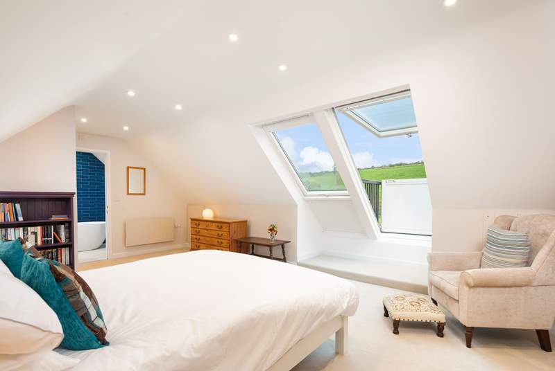 On the first floor, the spacious luxurious en suite with Velux roof balcony is a joy.