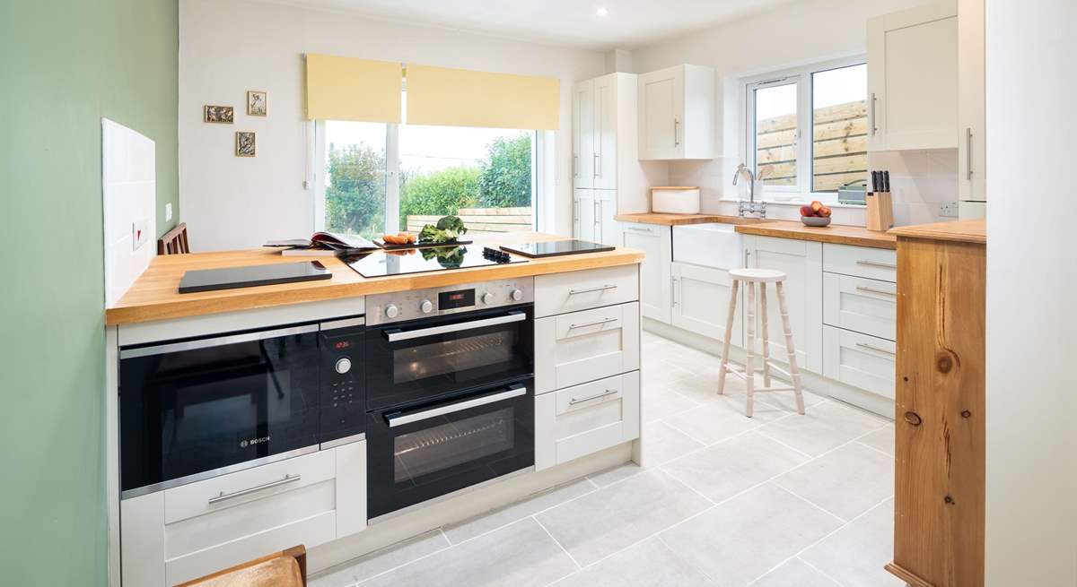 A well-equipped kitchen with a far reaching view over the Pembrokeshire countryside across to the Preseli mountains. 