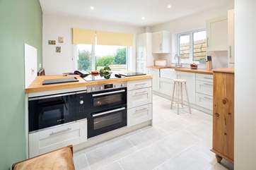 A well-equipped kitchen with a far reaching view over the Pembrokeshire countryside across to the Preseli mountains.
