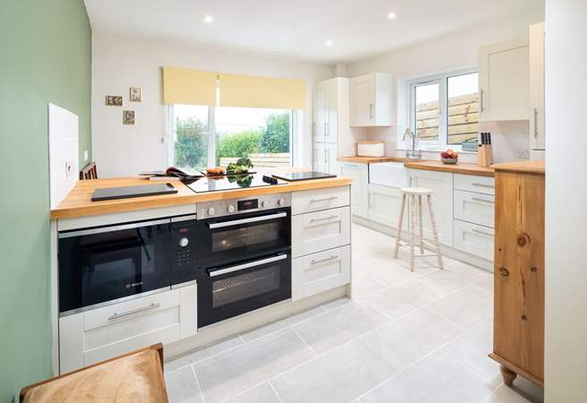 A well-equipped kitchen with a far reaching view over the Pembrokeshire countryside across to the Preseli mountains. 