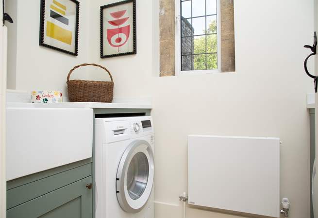 The utility-room with washing machine/drier.