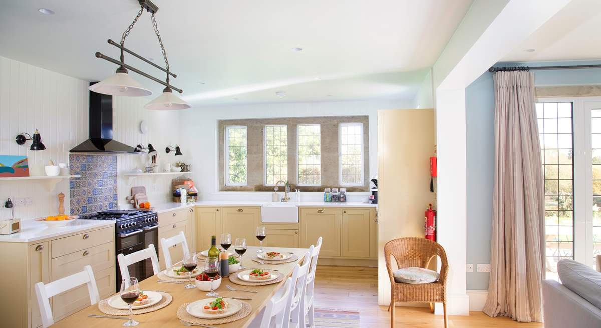 The kitchen is fully equipped and a sociable space to cook whilst chatting to family and friends.