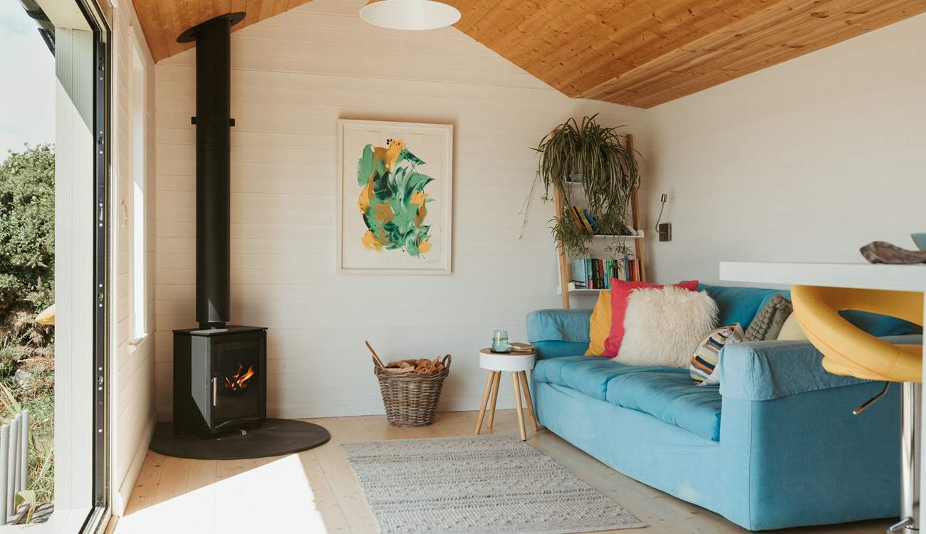 The living area is so inviting with bright bursts of colour to welcome you inside.