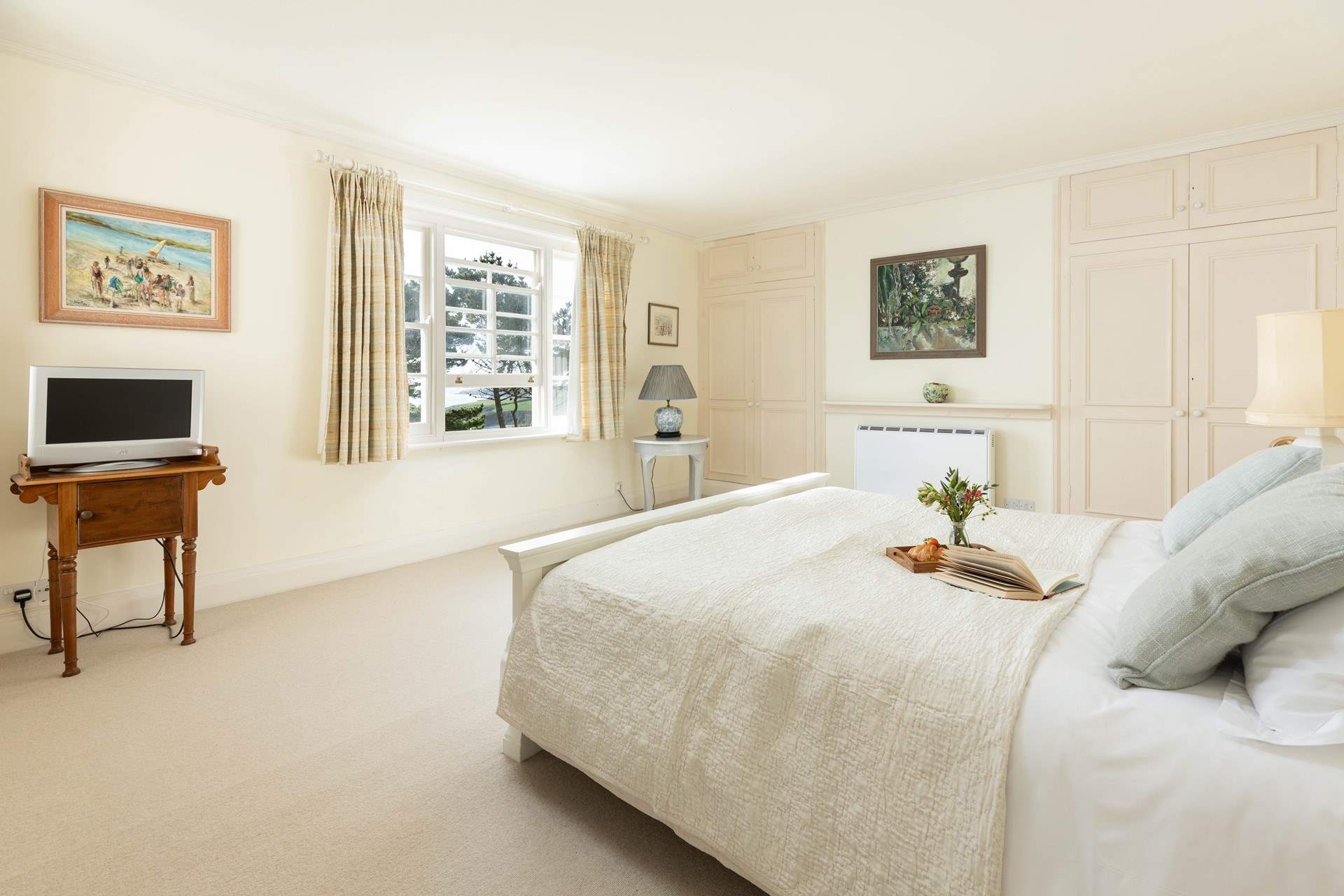 This gorgeous bedroom has stunning views. 