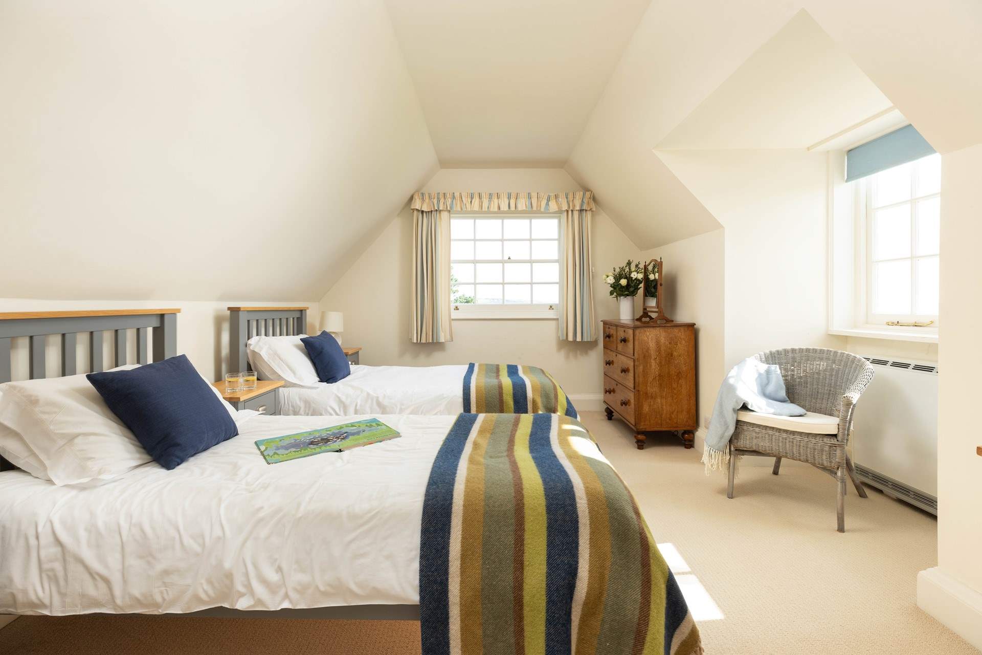 Bedroom 3 has twin beds and cosy linens. 