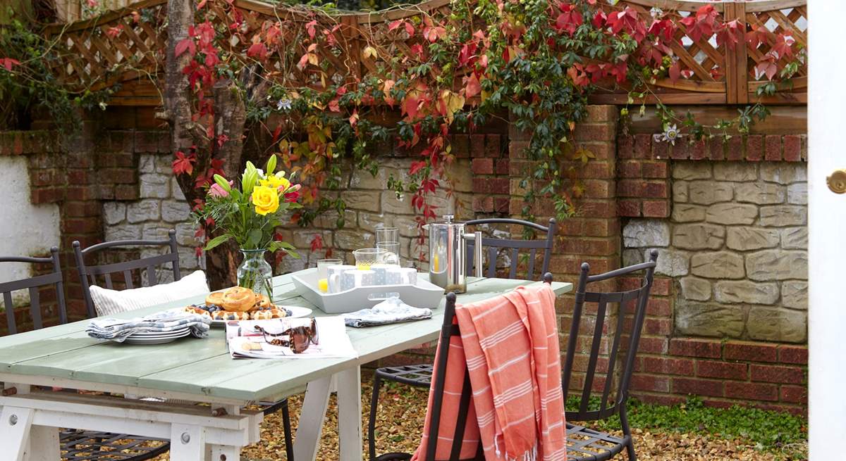 The rear courtyard is the perfect spot to enjoy a cup of coffee and a good read.