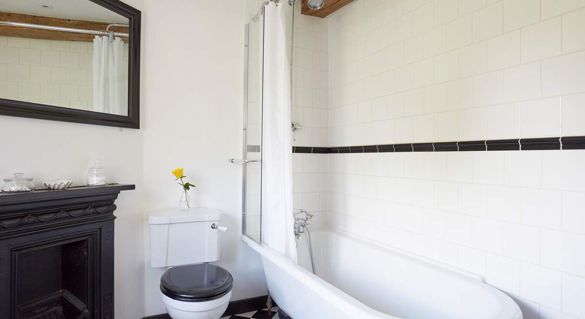 Family bathroom complete with roll-top bath and hand shower attachment for salty beach feet.